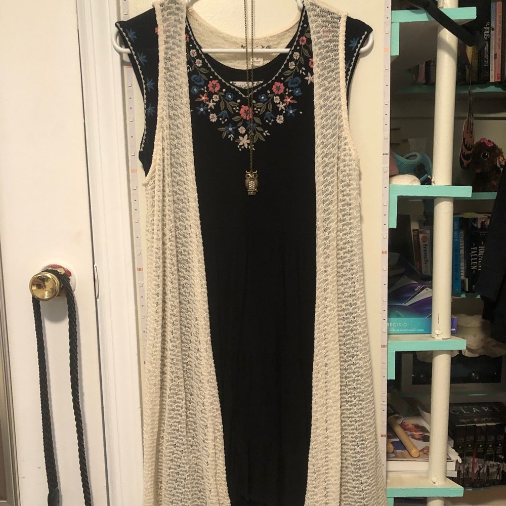 Black dress with floral pattern & removable white sweater w/gold owl necklace.